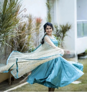 Fabulous Turquoise Taffeta Silk Solid Stitched Ethnic Gown With Net Embroidered Dupatta For Women